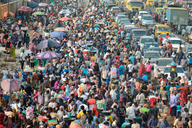 Large crowd of people and cars